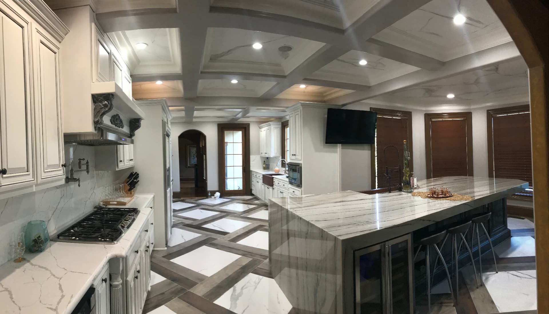 Finished open kitchen with coffered ceiling by Avicor Construction Services